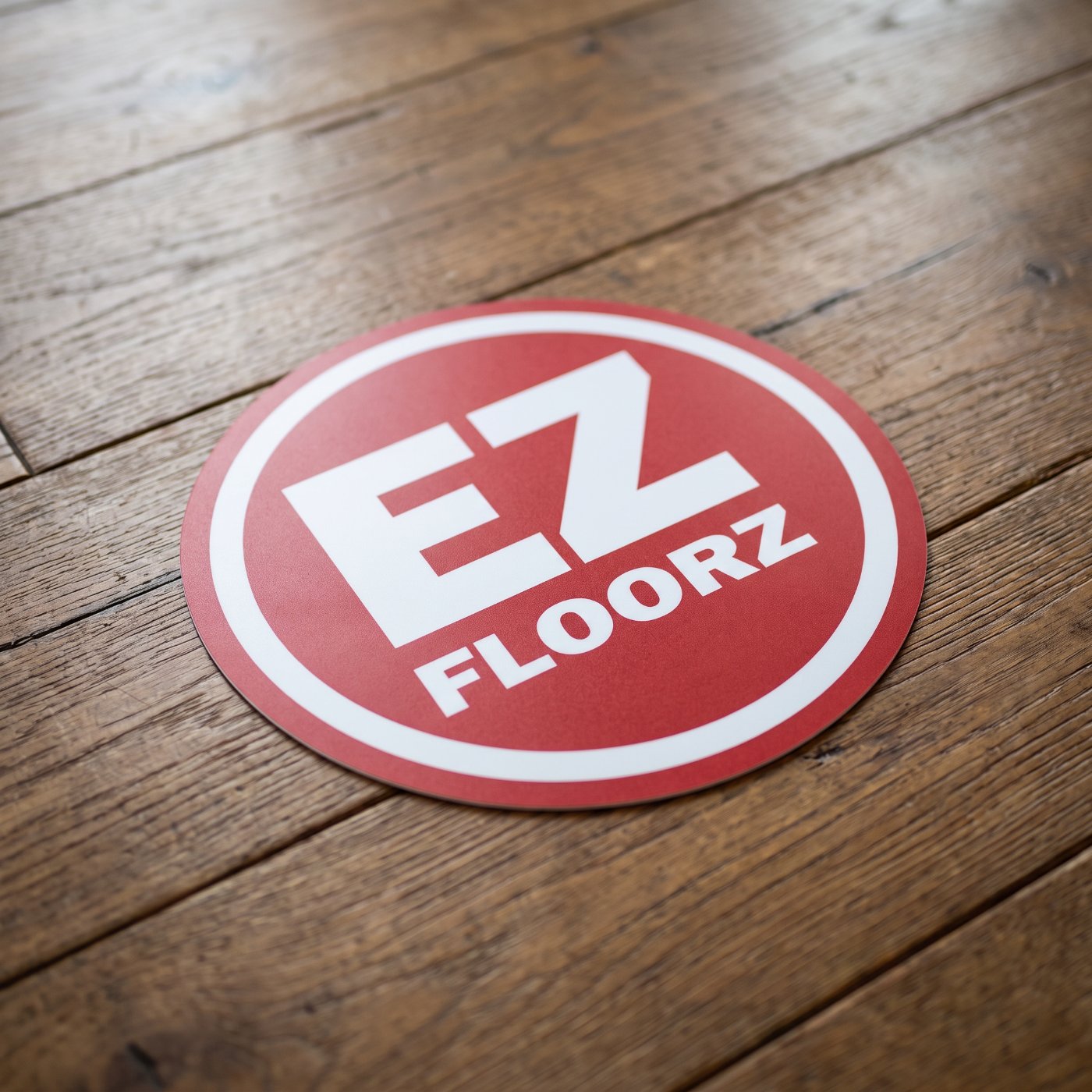EZ Floorz logo on hardwood flooring installed in Solon, Iowa