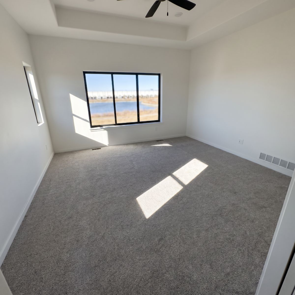 Plush carpet installed in a new-construction bedroom in North Liberty, Iowa