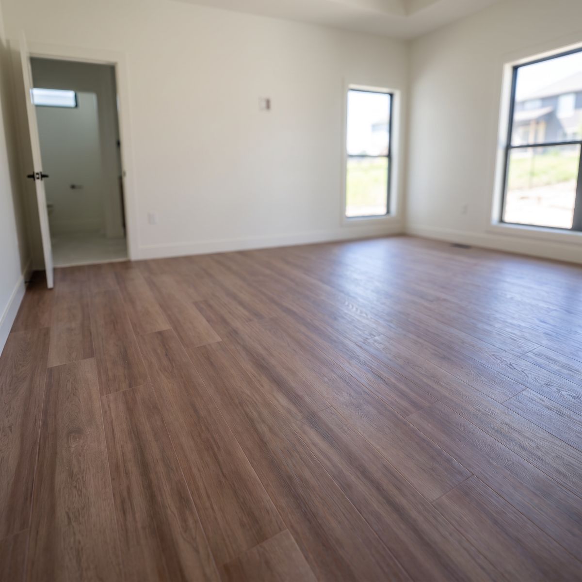 Southwind luxury vinyl plank flooring in a bedroom in North Liberty, Iowa
