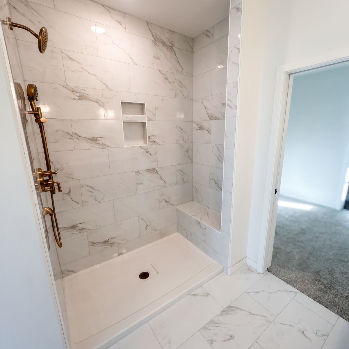 Custom tile shower with a built-in bench in North Liberty, Iowa